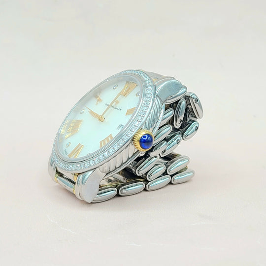 Silver watch with a light blue face on a white background