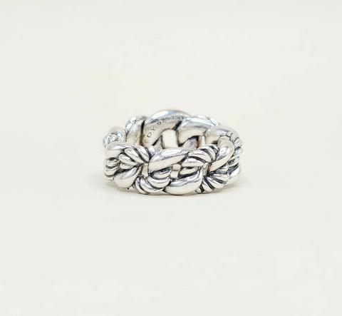 Silver braided ring on a white background