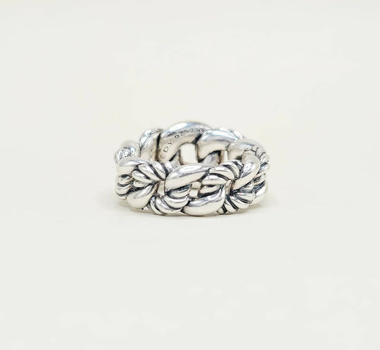 Silver braided ring on a white background