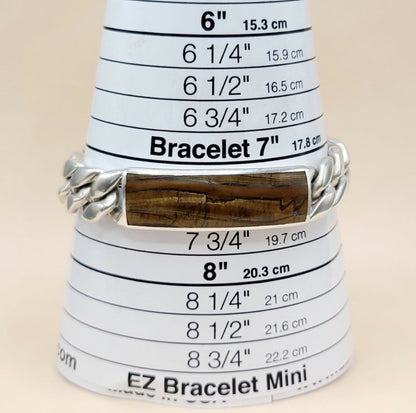 A silver chain bracelet with a polished brown wooden inlay, displayed on a white EZ Bracelet Mini size cone.