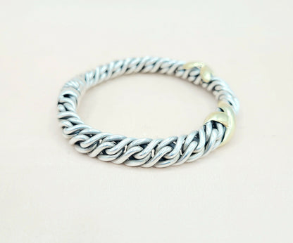 Silver chain bracelet on a light beige background