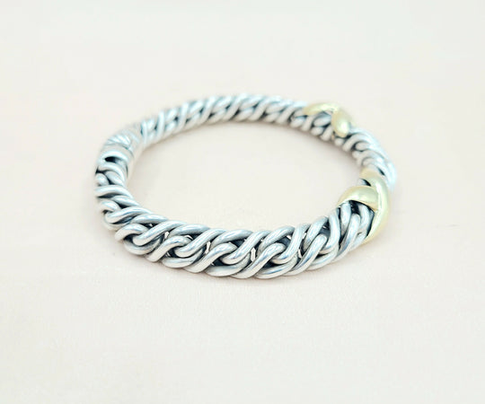 Silver chain bracelet on a light beige background