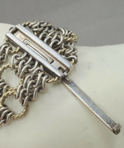 Silver chain necklace with a bar clasp on a white background