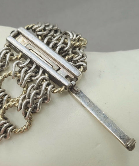 Silver chain necklace with a bar clasp on a white background