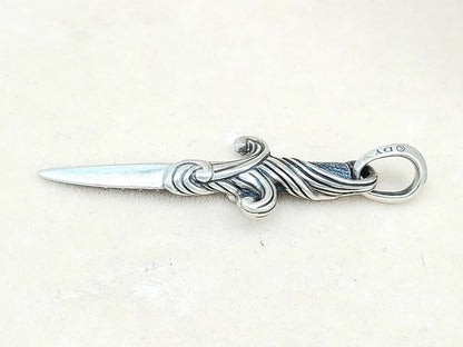Silver letter opener with decorative handle on a white background