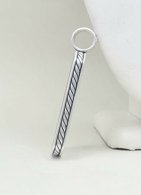 A sterling silver bar pendant with a twisted cable design and a circular loop at the top, displayed on a white jewelry bust against a light gray background.