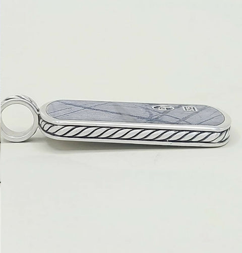 A silver-toned Gucci keychain or card holder featuring a blue-gray marble inlay with a subtle diamond pattern and a black twisted rope border, with the interlocking GG logo and a small square Gucci emblem on the top.